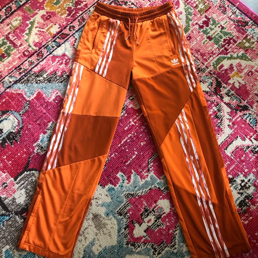 adidas Orange Track Pants with White Stripes and Color-Blocking Design